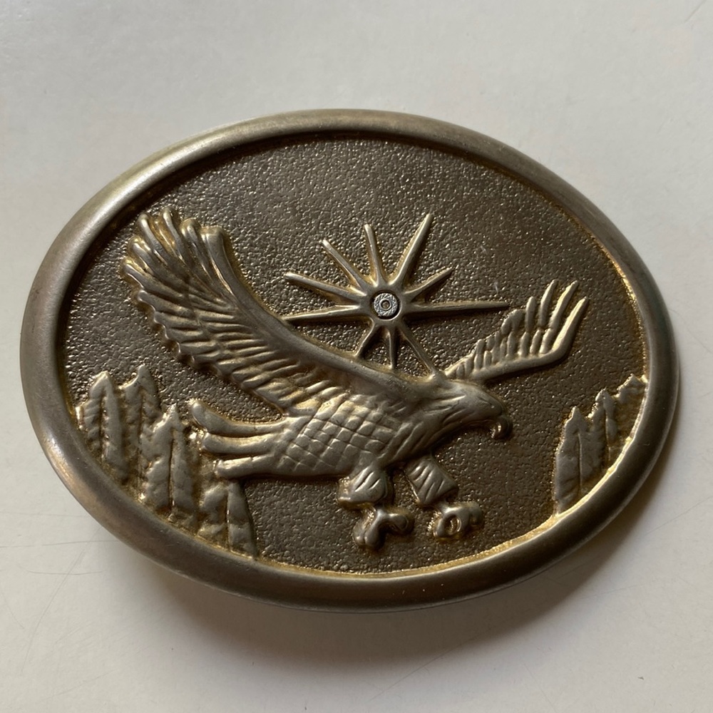 Silver gold-tone oval belt buckle flying Eagle with Sunburst.
